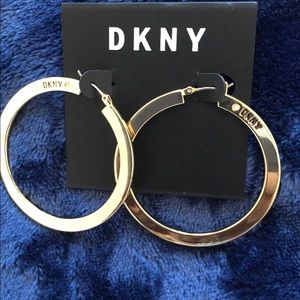 DKNY large hoop earrings;gold tone;logo